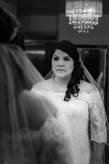 Bride looking int the Mirror