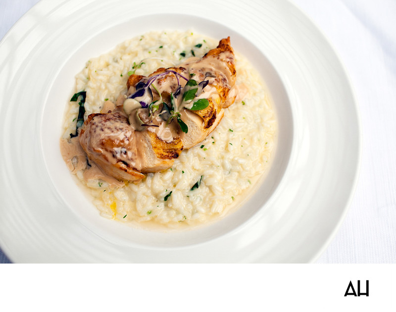 Roasted Chicken Served Over Creamy Risotto