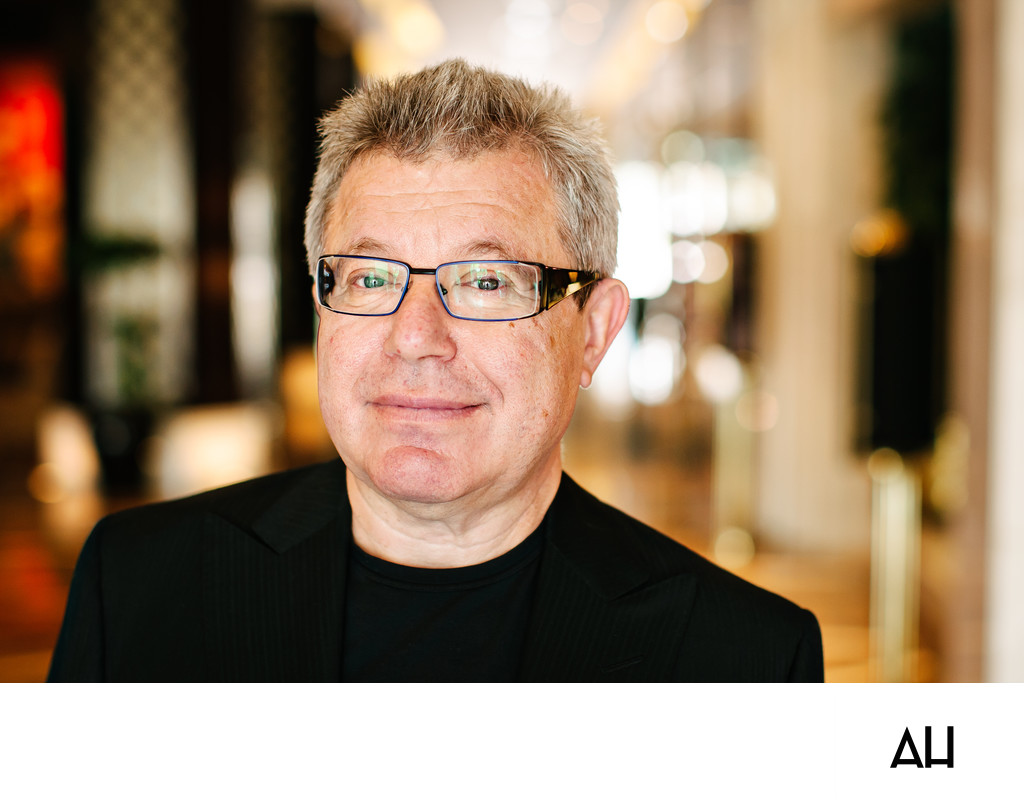 Professional Man with Glasses in Hotel Lobby