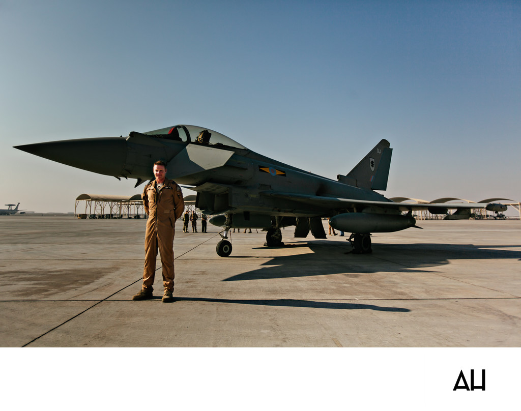 Military Pilot Standing Beside a Fighter Jet
