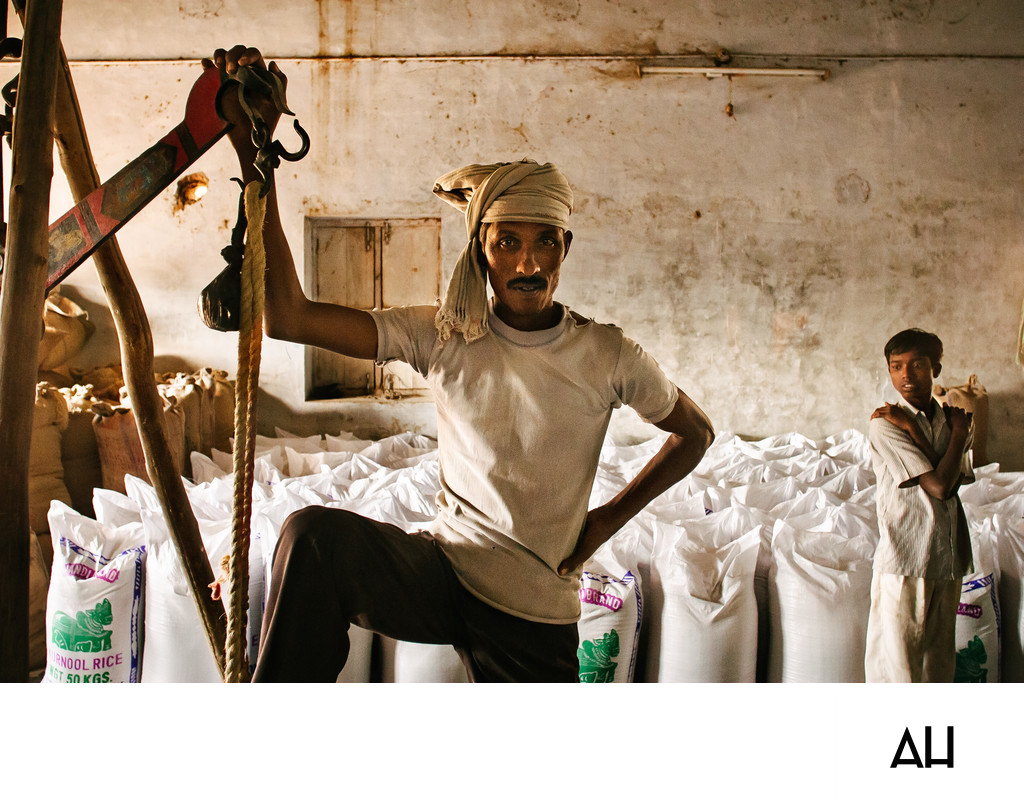 Rice Mill Worker with Hoist and Filled Sacks