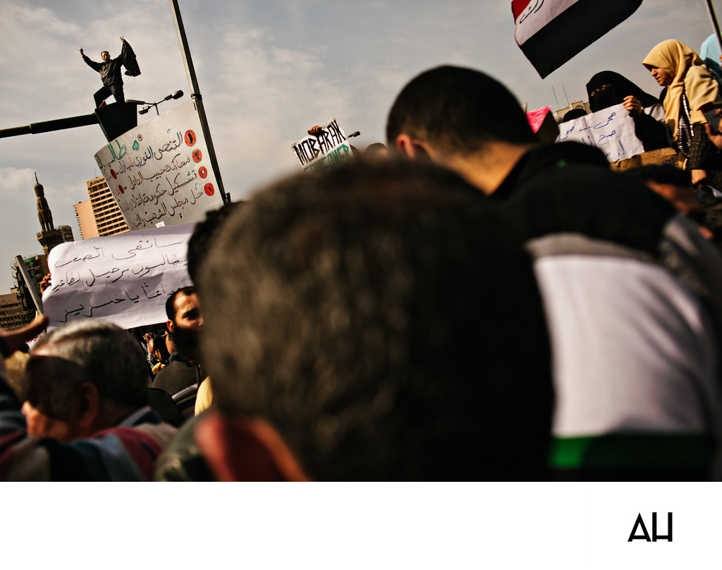 Cairo Protest Crowd with Signs and Egyptian Flag