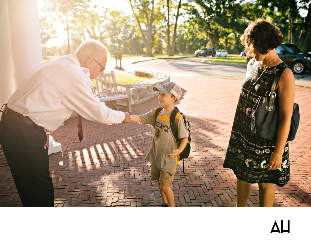 School Administrator Greeting a New Student