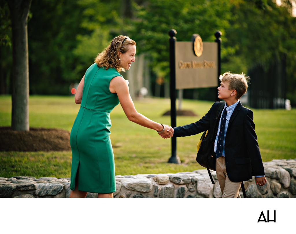 Teacher Welcoming a Student to Campus