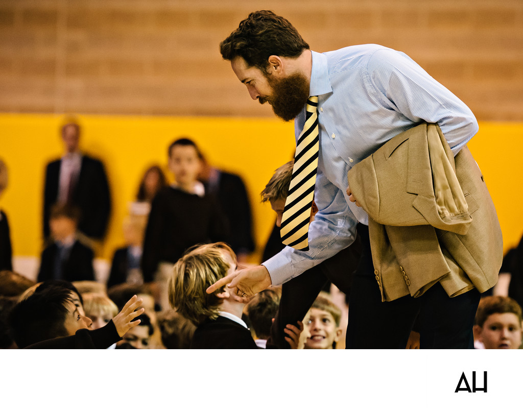 Teacher Connecting with Students at an Assembly
