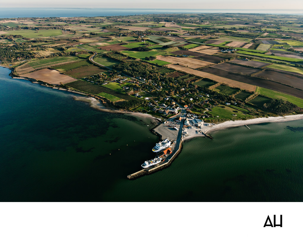 Aerial View of a Coastal Port and Farmland