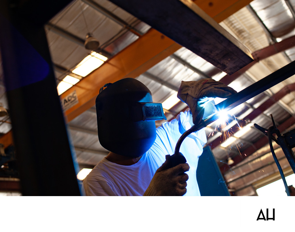 Welder Fabricating Steel in an Industrial Workshop