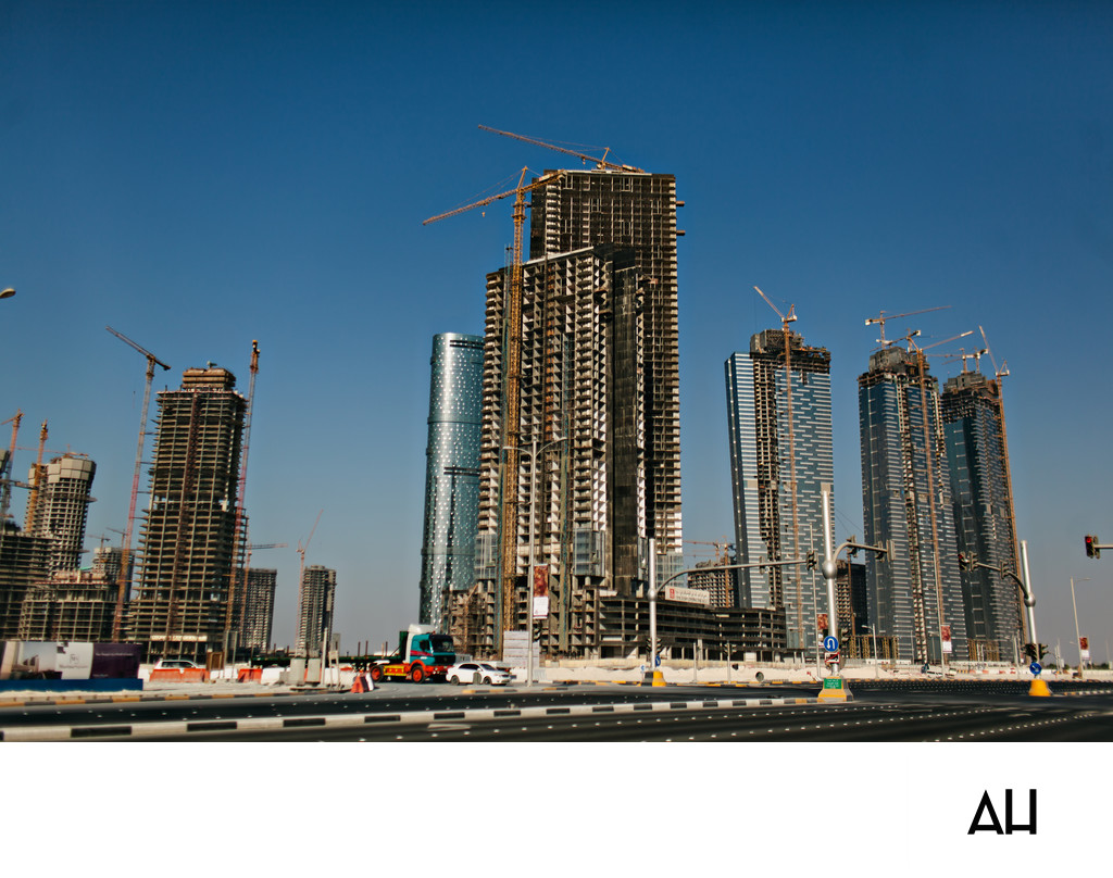 Urban Skyline Construction with Tower Cranes
