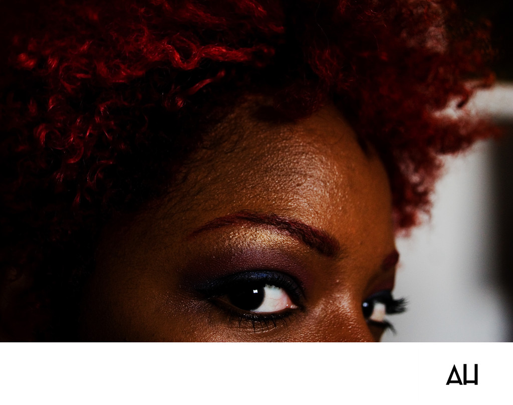 Beauty Portrait with Red Curls and Gold Makeup