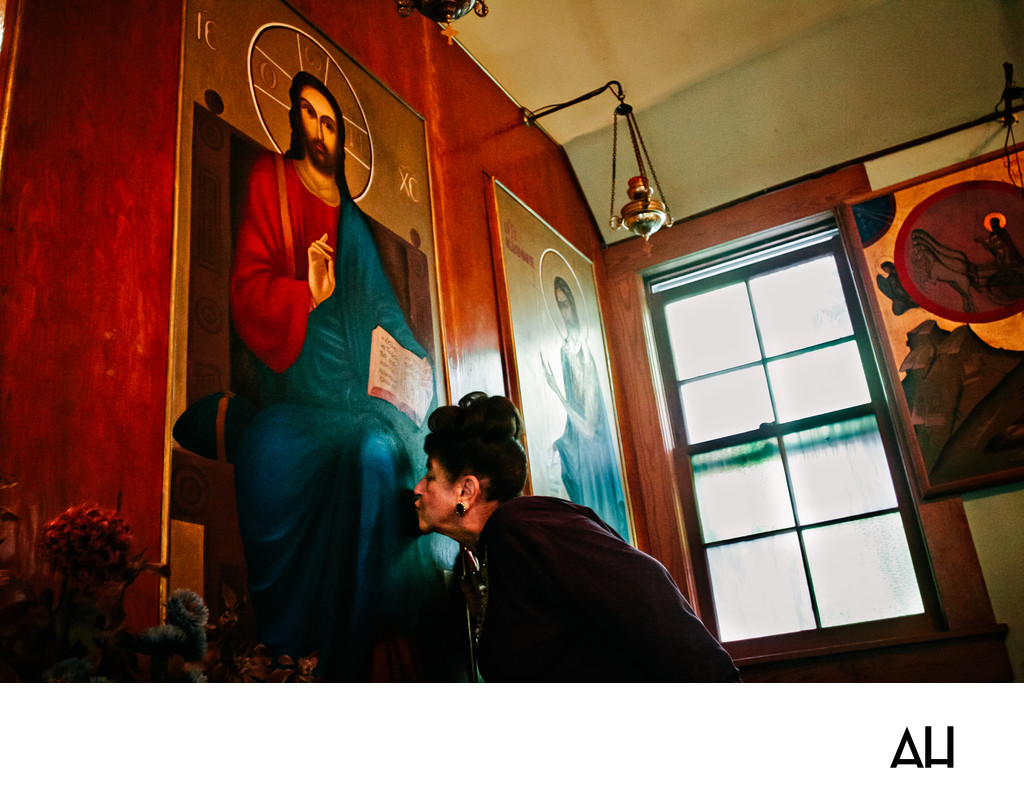 Woman Venerating an Orthodox Christian Icon