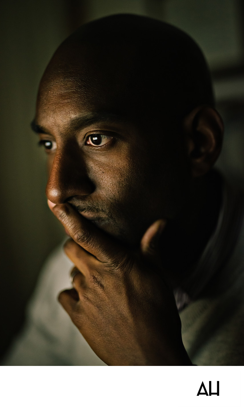Contemplative Man in Window Light