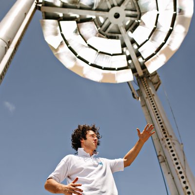Engineer Beneath a Solar Thermal Concentrator