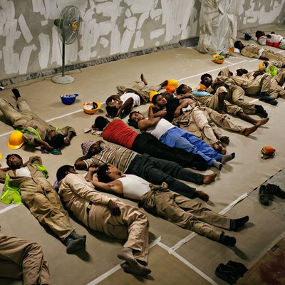 Construction Workers Rest Between Shifts