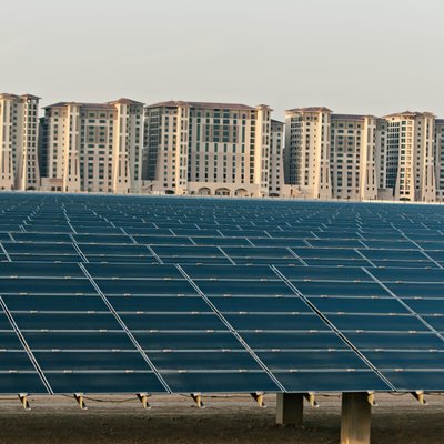 Large Solar Panel Field Beside Residential Towers