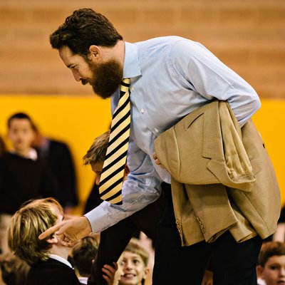 Teacher Connecting with Students at an Assembly