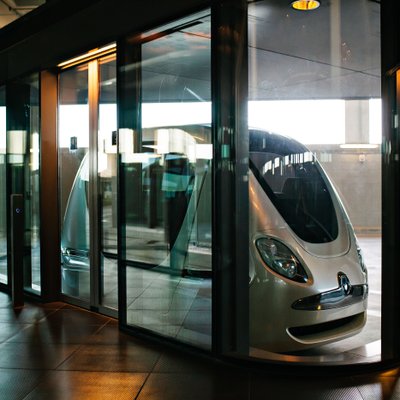 Autonomous Vehicle Inside a Glass Transit Station