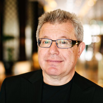 Professional Man with Glasses in Hotel Lobby