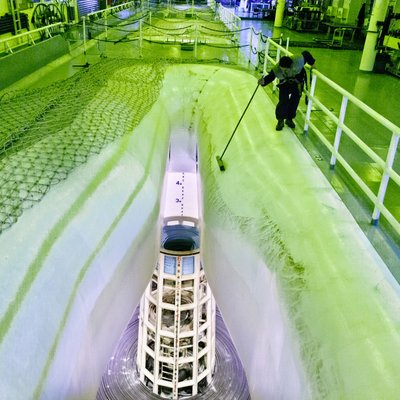 Technician Inspecting a Wind Turbine Blade Mold
