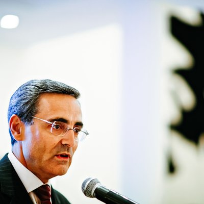 Government Official Speaking at a Podium