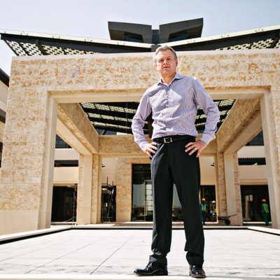 Corporate Executive Outside a Modern Building