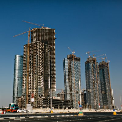 Urban Skyline Construction with Tower Cranes