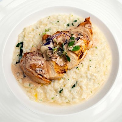 Roasted Chicken Served Over Creamy Risotto