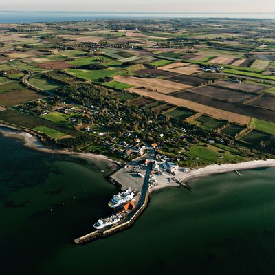 Aerial View of a Coastal Port and Farmland