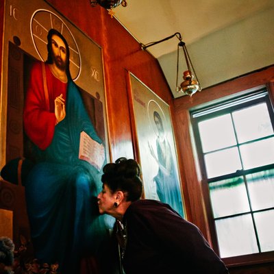 Woman Venerating an Orthodox Christian Icon