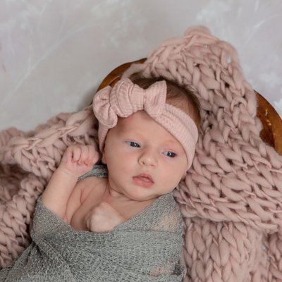 newborn baby on pink floral blanket bronxville