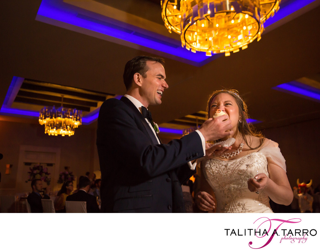 Sharing a cupcake during the wedding reception