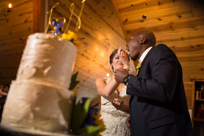 Bride and groom admiring their wedding cake