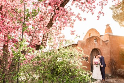 Taos chapel wedding spring flowers adobe