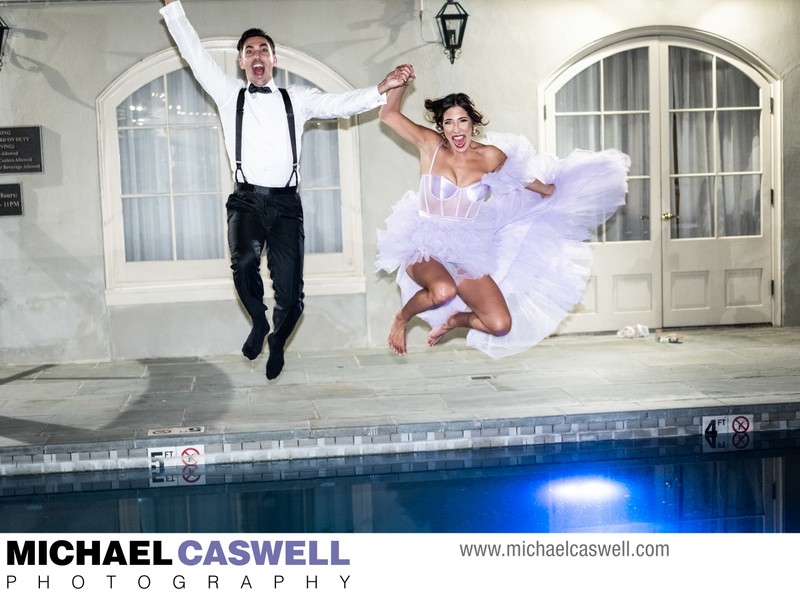 Bride and groom jump in pool at Maison Dupuy wedding