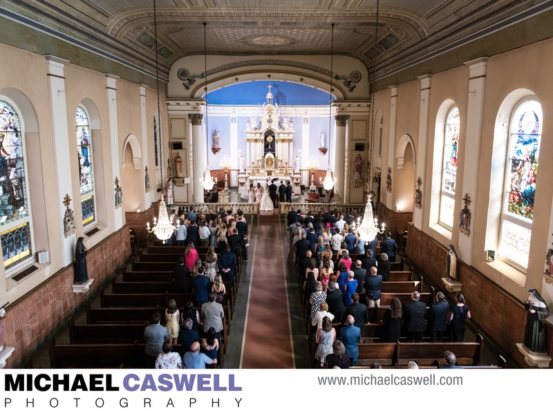 Wide angle photo of wedding at St. Mary's Catholic Church