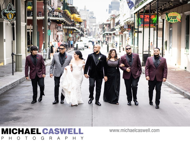 Bride and Groom and Family Walk Through French Quarter