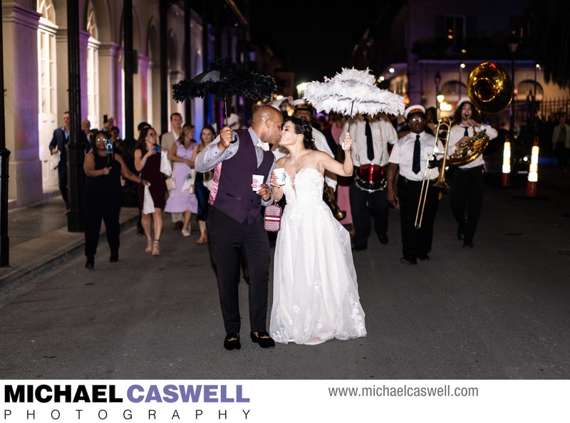 Couple Kisses During Second Line Parade