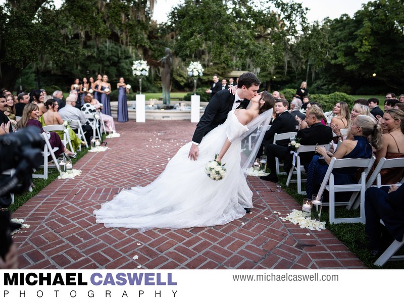 Groom Dips Bride at Botanical Garden Wedding