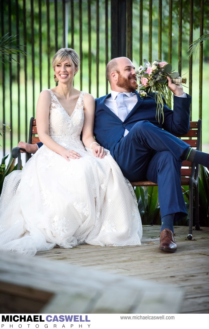 Groom Smells Bride's Flowers