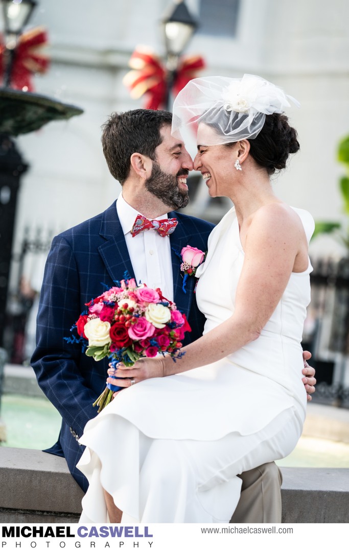 Bride and groom on Jackson Square fountain