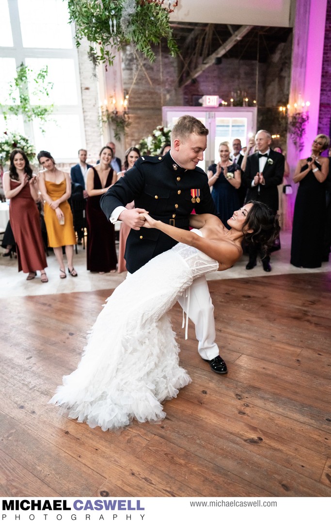 Groom dips bride during first dance