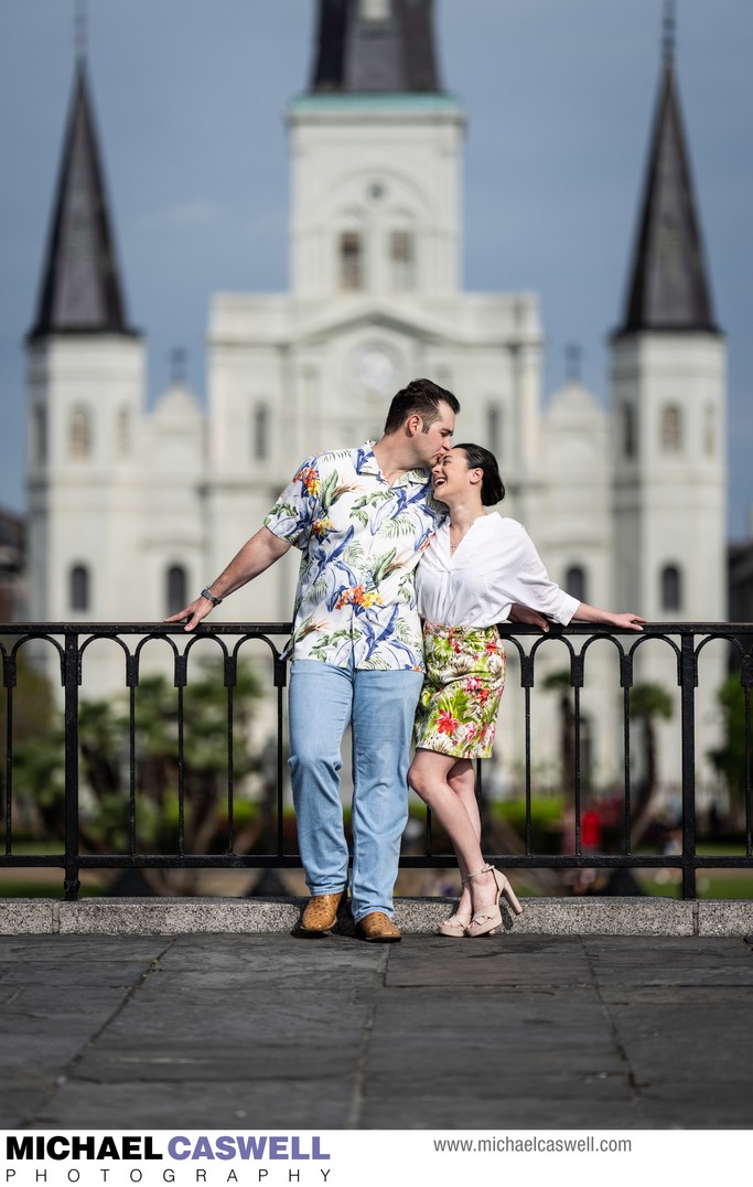 Engagement Portrait Kiss with Cathedral in Background