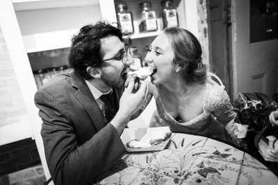 Couple Shares Beignet at Café Beignet After Wedding