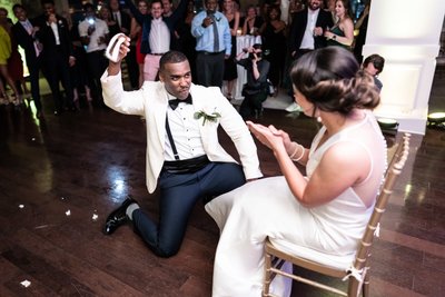 Groom Throws Garter at Riverview Room Wedding