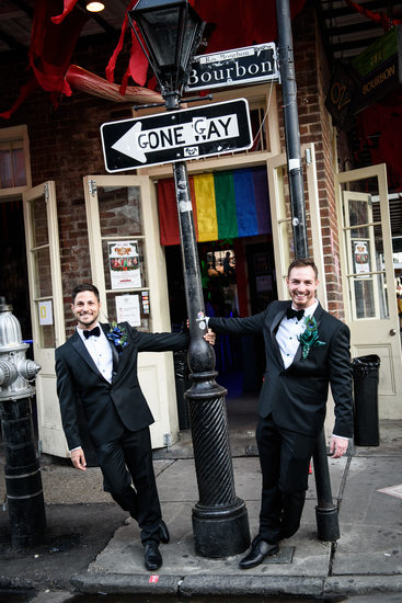 Two Grooms by Gone Gay Street Sign