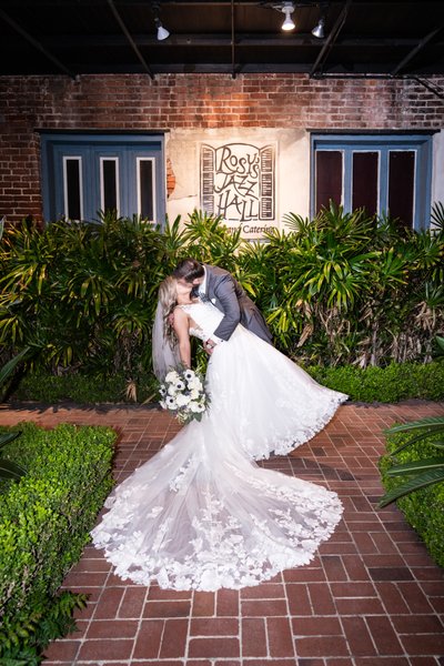 Groom Dips Bride in Front of Rosy's Jazz Hall