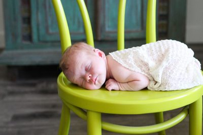 Baby Asleep on Green Chair