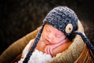 newborn asleep with hat 