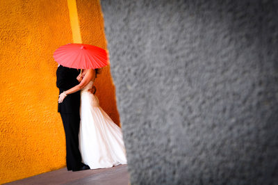 Bride and Groom Under Umbrella