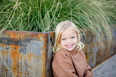 Young girl rustic planter family photography