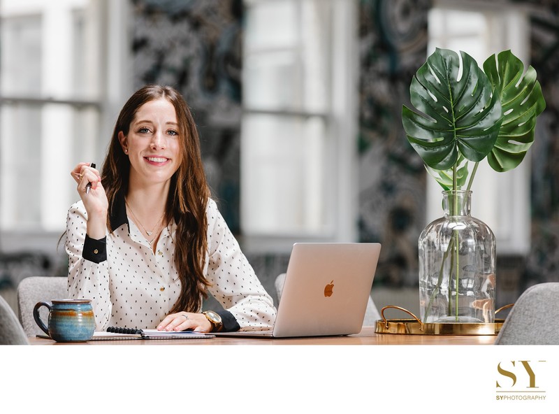 modern office scene NYC young woman at desk